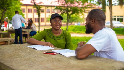 Two students studying outdoors