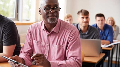 Male student in pink shirt