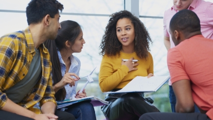 group of adolescents talking in study group