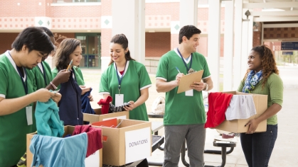 group of college students volunteering and donating