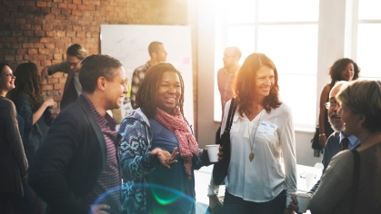 Group of professionals networking and talking