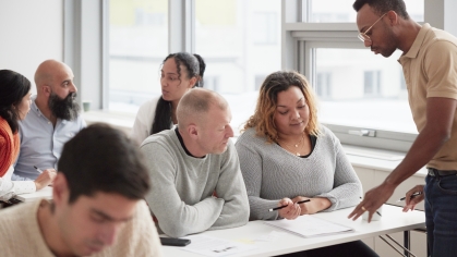 instructor and students in adult education class