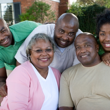 Family poising outdoors