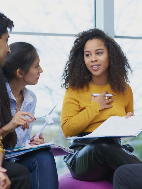 group of adolescents talking in study group