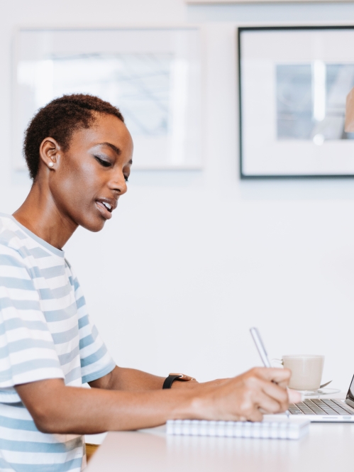 woman working on laptop in home office