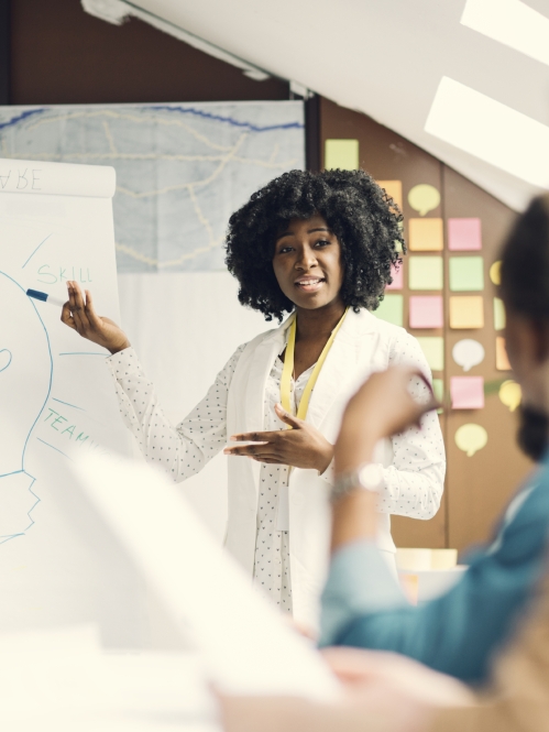 woman leading adult education training session