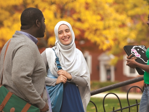 Two students speaking with eachother