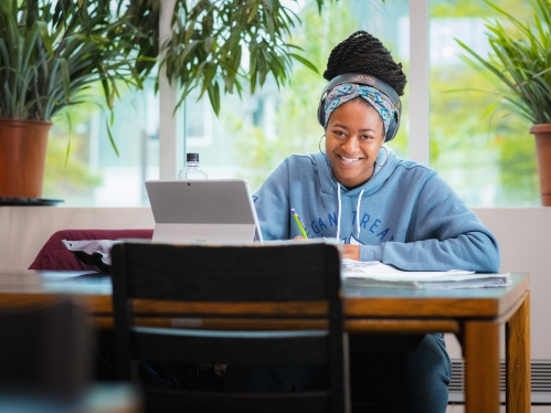 Smiling student in library