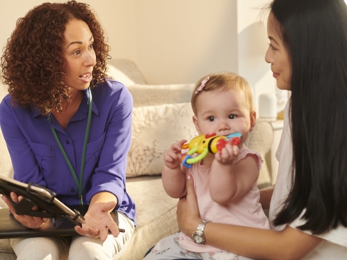 Social worker with mother and child