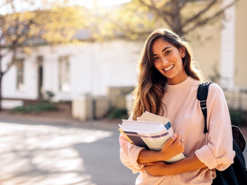 Student holding books